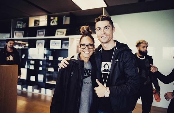 Heather Van Norman taking a picture with Cristiano Ronaldo.